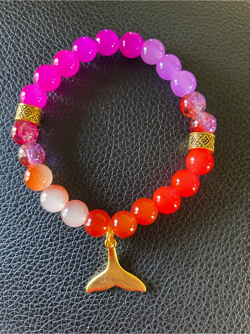 Pink,purple,orange glass beaded bracket with gold accents and mermaid tail charm